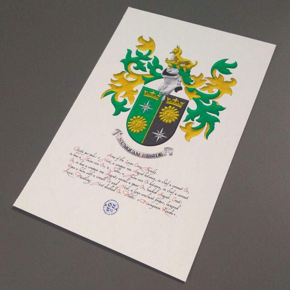 Party per pale: 1 Vert, a compass rose Argent between, in chief a coronet Or, in base a Taino sun Or; 2 Sable, a Taino sun Or between, in chief a coronet Or, in base a compass rose Argent; overall a spear Or, headed Argent. Crest: Upon a helm with a wreath Or and Vert, a lynx couchant proper, langued Azure. Mantling: Vert doubled Or. Motto: �Numquam reside�.