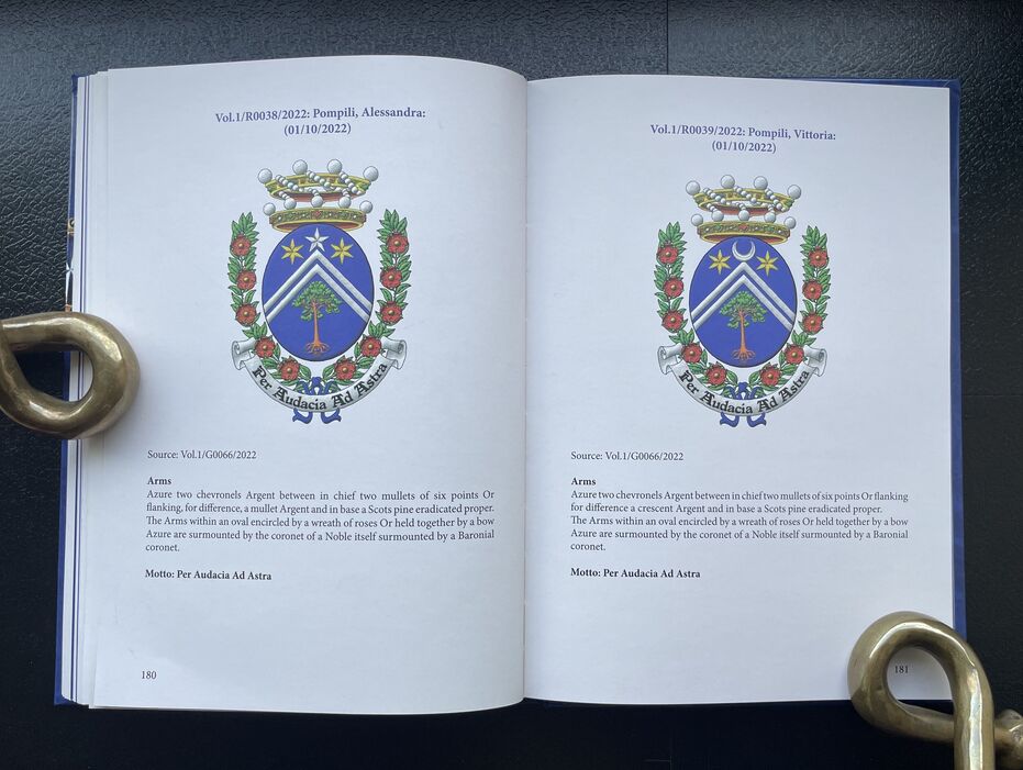 Double page spread 180-181 from the book with two coats of arms painted by me.