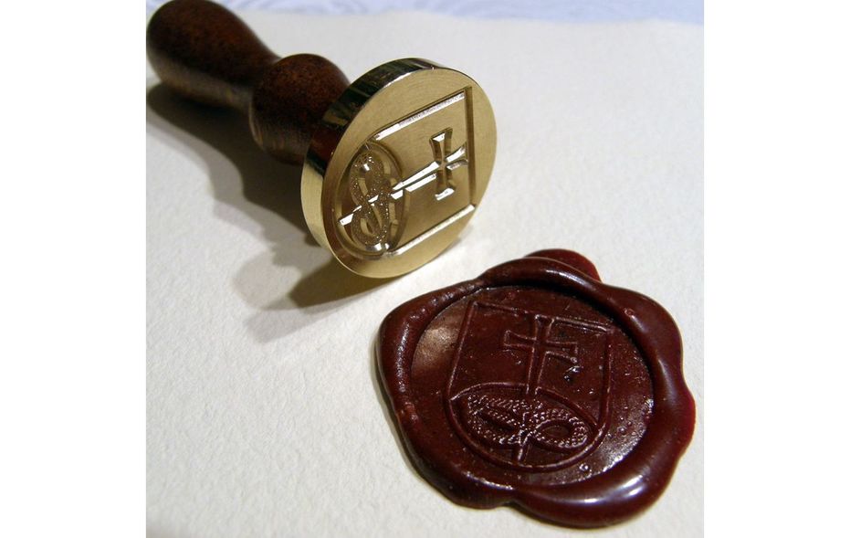 Gules, a base enarched Vert, overall a Latin cross patty fitchy Or, piercing in base the head of a serpent nowed and facing sinister Sable, langued Gules.