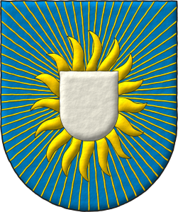 Escudo de azur, un escusn de plata, llameante en orla de Diecisis llamas y radiante de sesenta y cuatro lneas movientes todas de oro.
