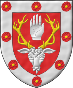 Escudo de gules, un rencuentro de ciervo de plata, ramado de oro, entre sus cuernas, una mano diestra apalmada y cortada por la mueca; una bordura de plata cargada de ocho camelia de Gules, botonadas de oro.