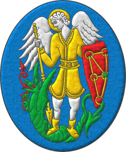 Emblema de azur, un San Miguel de plata, vestido y nimbado de oro, en su diestra una lanza de oro, con la punta hacia abajo y en su siniestra trae [ escudo de gules, cinco cadenas enlazadas, dos en cruz, dos en sotuer y una puesta en orla de oro; brochante en el centro, una esmeralda de sinople, de Navarra ], sostenido por un dragn de sinople, armado, lampasado, fierezado y encendido de gules.